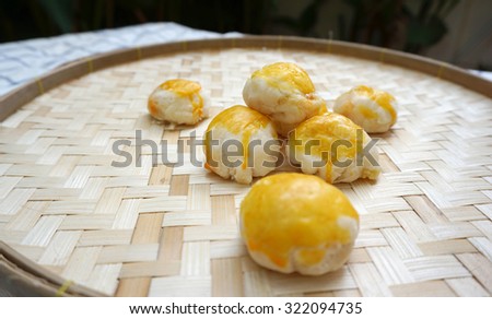 Chinese pastry with salted egg yolk on woven basket