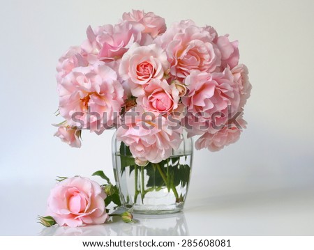 Bouquet of soft pink roses in a vase. Floral still life with roses.