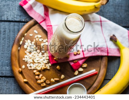 banana smoothie with oat flakes and milk in the bottle,healthy breakfast