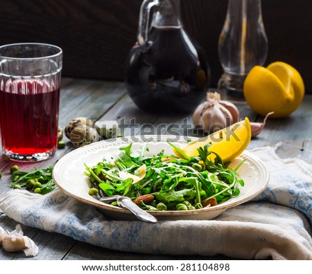 green salad with arugula, cheese, almonds, lemon, garlic, snack, clean eating