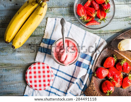 strawberry-banana ice cream in a glass fruit dessert, summer, clean eating,top view