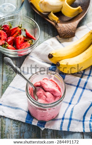 strawberry frozen smoothies in a glass, healthy dessert, summer,selective focus, raw banana