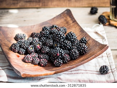 detox organic blackberries in a glass on a wooden plate, rustic,clean\eating