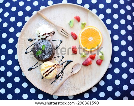 Chocolate Lava Cake with ice cream and orange strawberry fruit