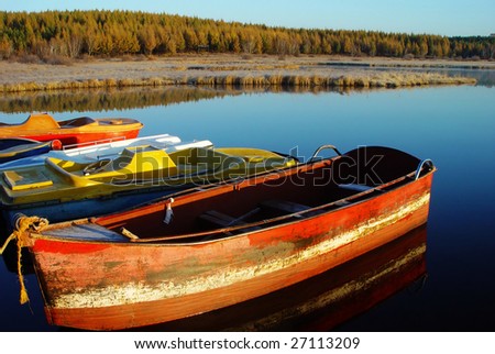 Ferreous  boat in the lake in the early morning at sunrise