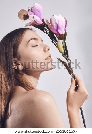 Similar – Image, Stock Photo Individual cosmetics flower in bloom in a vase in the shape of a metal jug