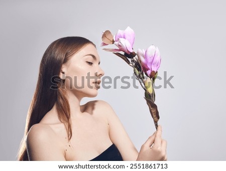 Similar – Image, Stock Photo Individual cosmetics flower in bloom in a vase in the shape of a metal jug