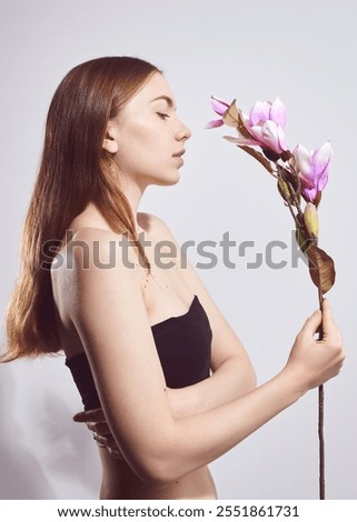 Similar – Image, Stock Photo Individual cosmetics flower in bloom in a vase in the shape of a metal jug