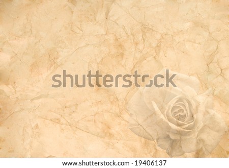 Abstract vintage background (old crumpled paper with a rose in the corner)