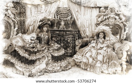 Two girls wearing antique princess dress and sitting on princess thrones (vintage style)