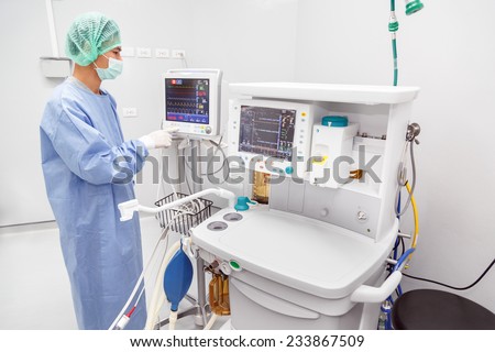 NAKHONRATCHASIMA, THAILAND - November 15, 2014: Doctor working with medical equipment in operation room of modern hospital, November 15, 2014 in Nakhonratchasima, Thailand.