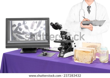 modern microscope with a doctor with liver fluke