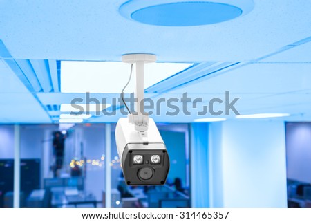 Modern security camera in business office workplace