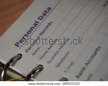 Opened notebook on personal data page, fill in data, name, address, telephone number