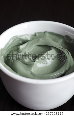 Green cosmetic clay in a bowl