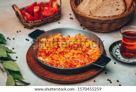 Similar – Image, Stock Photo Fried eggs with tomatoes and broccoli in white frying pan on kitchen table with ingredients. Top view. Healthy breakfast