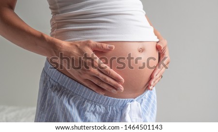 Similar – Image, Stock Photo Pregnant woman caressing her belly