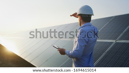 Similar – Image, Stock Photo Photovoltaic power station or solar park. PV system. Solar farm and green field. Solar power for green energy. Photovoltaic power plant generate solar energy. Renewable energy. Sustainable resources.