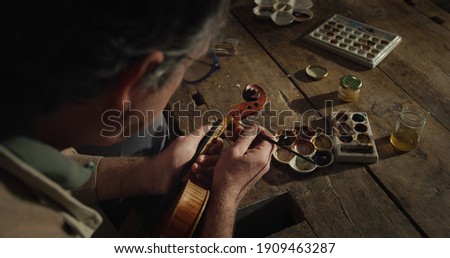 Similar – Image, Stock Photo Craftsman with violin in professional workshop