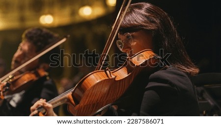 Similar – Foto Bild Nahaufnahme einer Violine mit Bogen. Braune Orchestergeige. Finger auf der Tastatur der Violine.