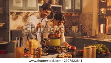 Similar – Image, Stock Photo Couple preparing food in kitchen.