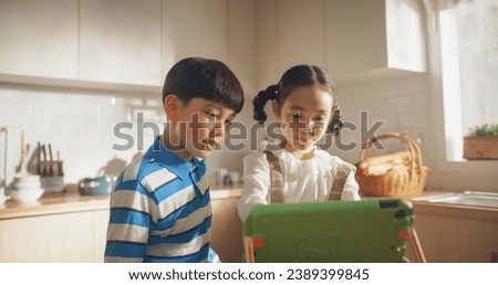 Similar – Image, Stock Photo Brother and sister watching lake