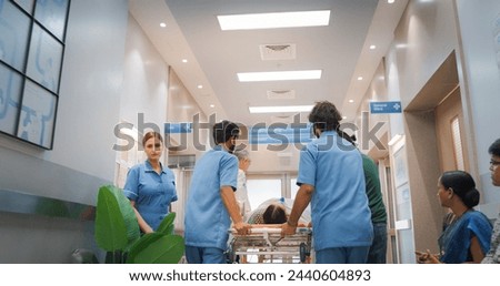 Image, Stock Photo Group of doctors transporting patient to operating room