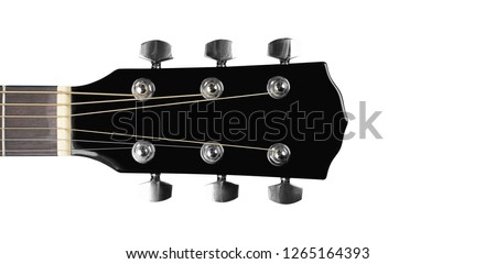 Image, Stock Photo A black guitar head with the golden tuning pegs and the plastic and metal sides attached to the white screws. A small part of the fingerboard is still visible.