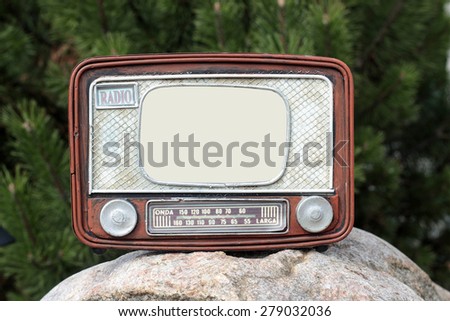 Vintage frame for the photo in the form of old radio on a green background.
