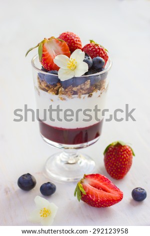 dessert with fresh berries,  cream cheese, granola and berries  jam