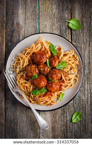 Spaghetti pasta  with meatballs and tomato sauce,  top view