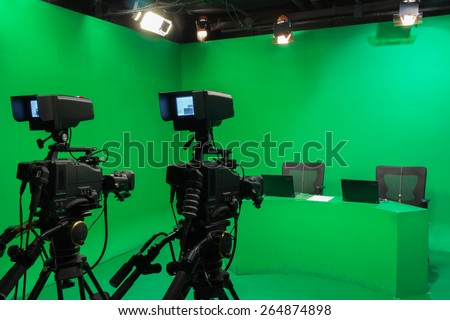 Television studio with camera and lights - camera on tripod: Shallow depth of field