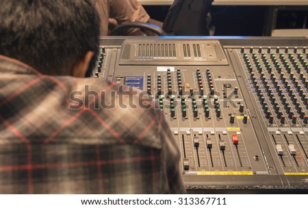 sound technician in recording studio