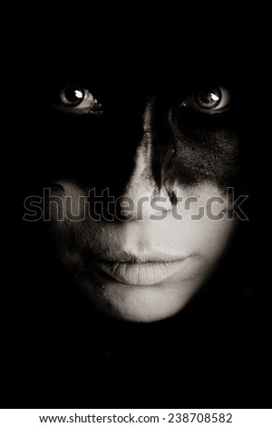 Portrait of a Girl With Black and White Make-Up on a Black Background. Photo, Picture