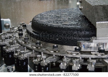 Part of a machine washing bottles at the factory for the production of medicines