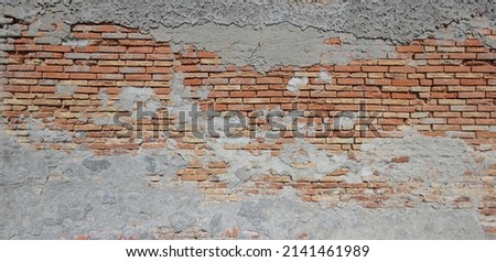 Panoramic view of the brickwork. Brick wall with peeling concrete plaster as background. Foto stock © 