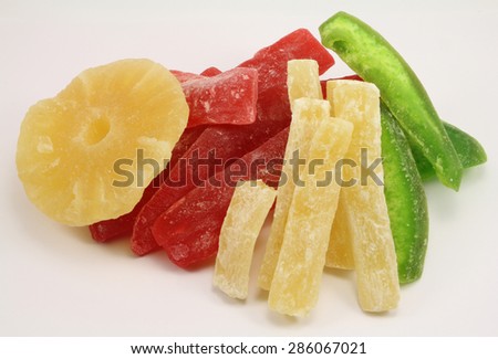 Assorted Dried pineapple slices with dried Pamela on a white background