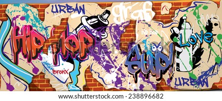 graffiti wall. a graffiti wall with sprayed words and logos on plaster, the brick wall is showing through.