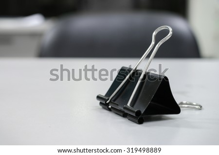 The side binder clip one the table.