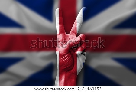 Hand making the V victory sign with flag of great britain Stock fotó © 