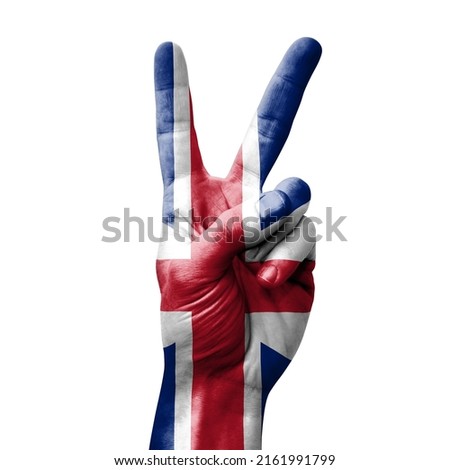 Hand making the V victory sign with flag of great britain Stock fotó © 