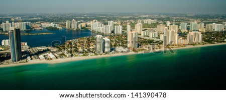 Panoramic view of Miami skyline showing waterfront and calm sea, Florida, U.S.A.