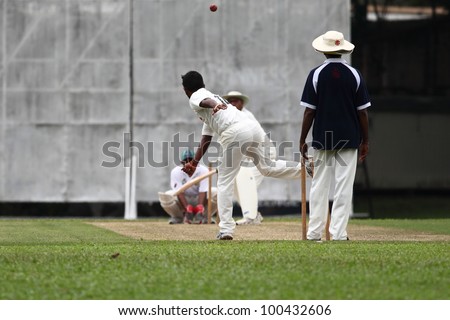 KUALA LUMPUR, MALAYSIA - MARCH 3 : Unidentified bowler throws a ball during a friendly match between Royal Selangor Club and Silver State Cricket Club on March 3, 2012 in Kuala Lumpur, Malaysia
