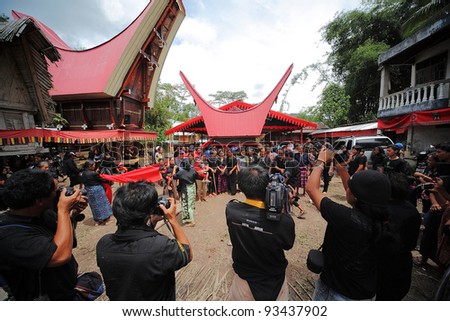 TANA TORAJA, INDONESIA- JAN 30: Cameraman take the deceased family photo before burial procession begin on Jan 30,2010 in Tana Toraja,Indonesia. Funeral rites in Tana Toraja is rich with old tradition