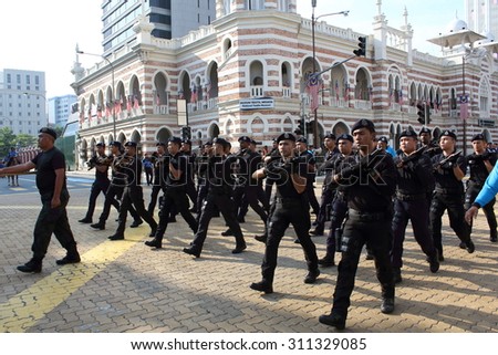 KUALA LUMPUR-Aug 28: Narcotics Criminal Investigation Division (NCID) from Royal Malaysia Police (PDRM) during rehearsal for National Day parade on Aug 28,2015 at Dataran Merdeka,Kuala Lumpur,Malaysia