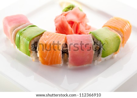Rainbow Maki Sushi - Roll with Eel and Cream Cheese inside. Tuna, Salmon and Avocado outside