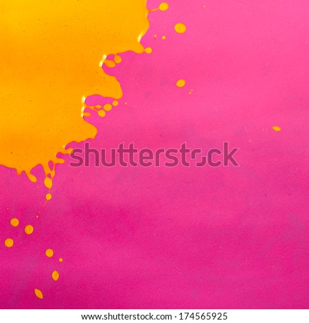 Yellow Paint Splash over Magenta Background