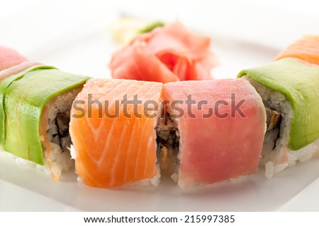 Rainbow Maki Sushi - Roll with Eel and Cream Cheese inside. Tuna, Salmon and Avocado outside
