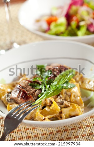 Pasta with Beef, Mushrooms, Lettuce, Herbs and Cream Sauce