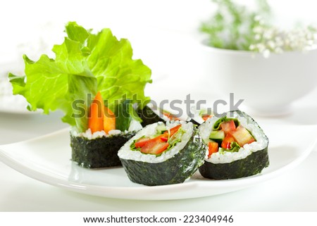 Vegetarian Maki Sushi -  Roll made of Tomato, Cucumber, Bell Pepper, Salad Leaf